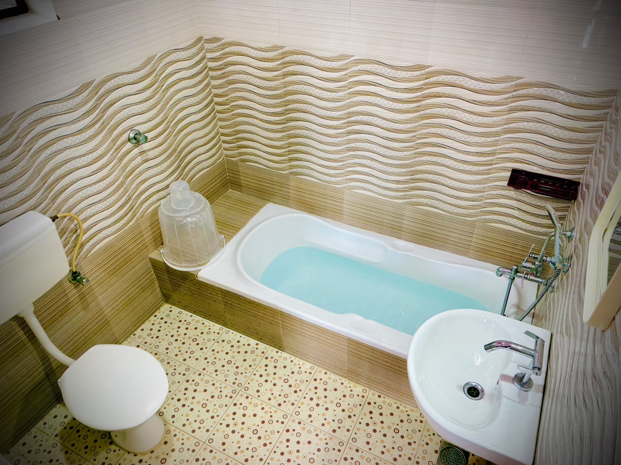 Double room arranged with towels and writing desk