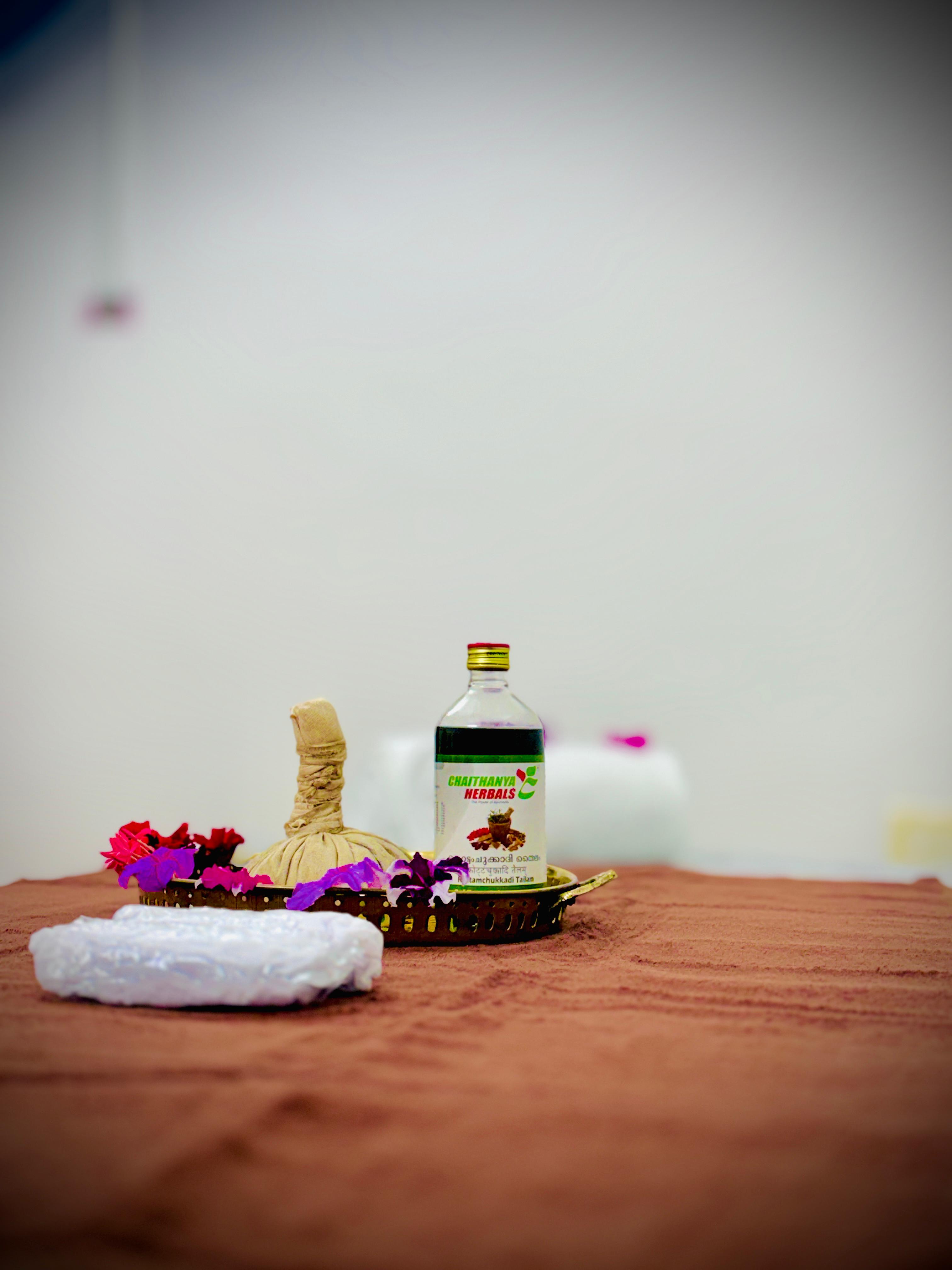 Peaceful Ayurvedic wellness session with herbal oils and natural décor.